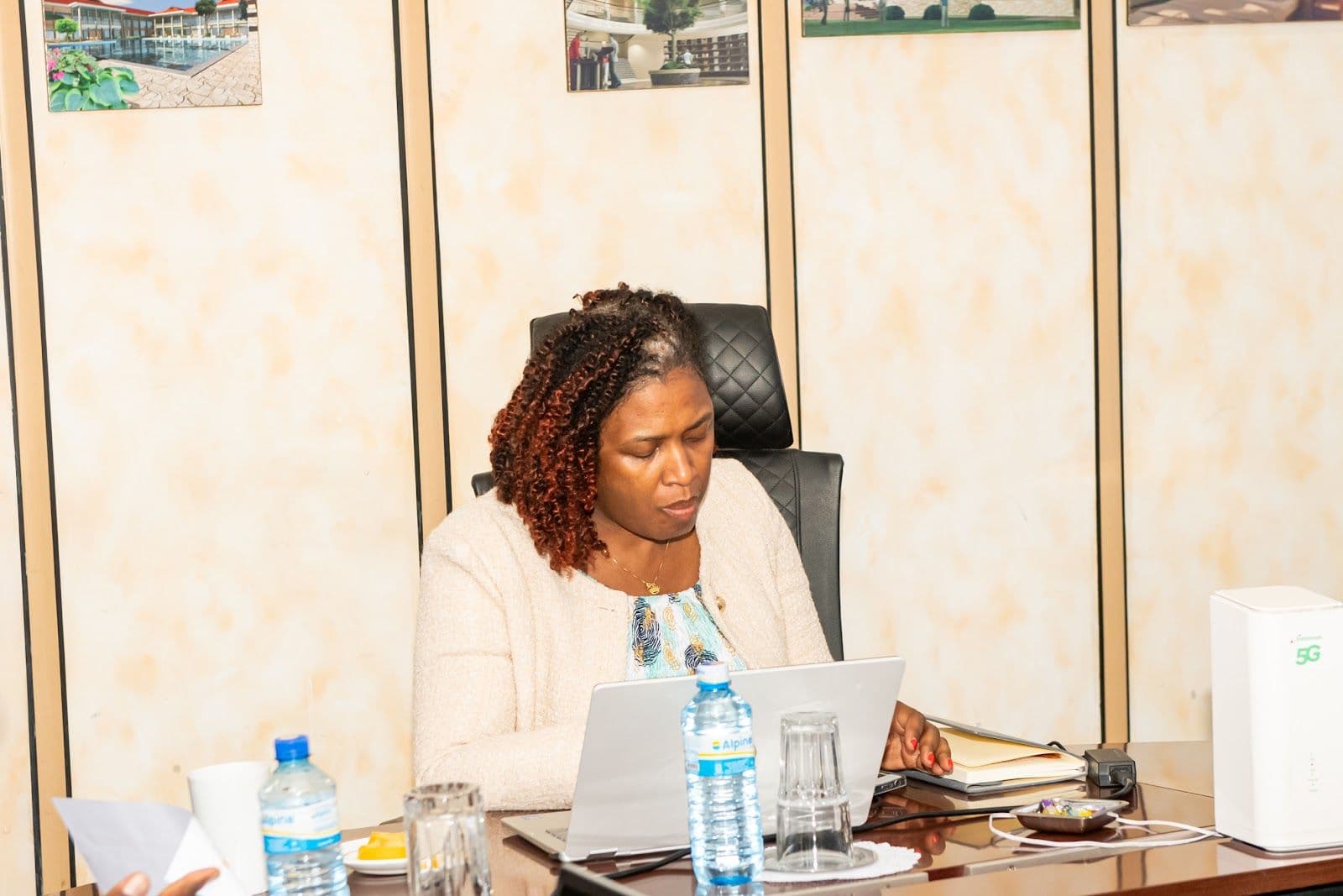 A delegate reviews material on a laptop during a working session of the study tour.
